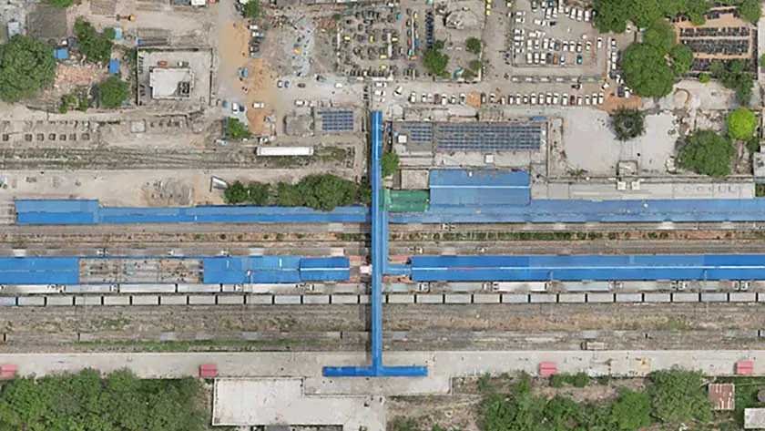 Drone orthomosaic of a railway station yard with platforms and a foot-over-bridge